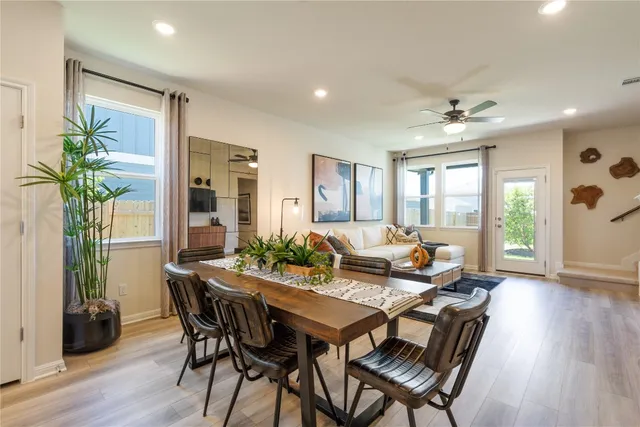 a view of a dining room with furniture window and wooden floor