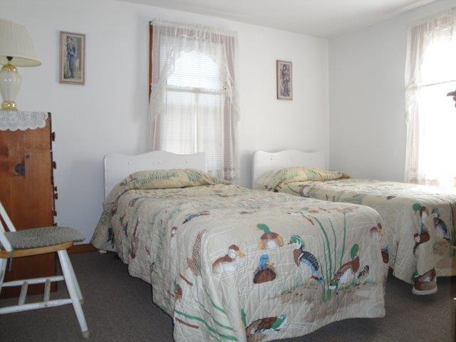 80 Uncle Rolf Road Dennis Port, MA 02639 - Photo 8 of 10 a bedroom with a bed and a window
