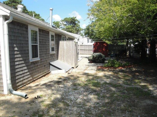 80 Uncle Rolf Road Dennis Port, MA 02639 - Photo 10 of 10 a front view of a house with garden