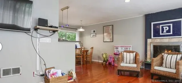 a living room with furniture and a flat screen tv