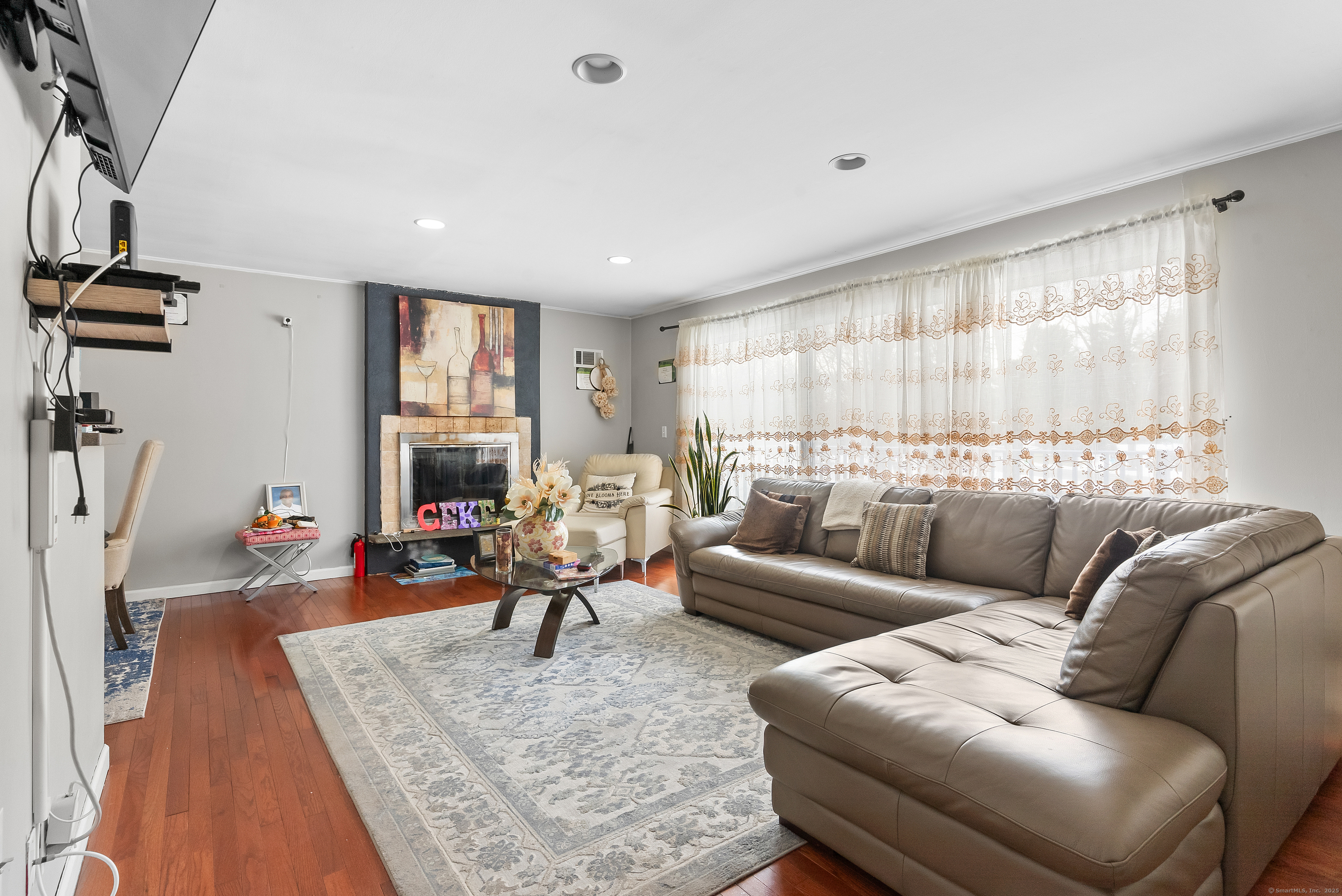 8 Stonecrop Road North Norwalk, CT 06851 - Photo 12 of 15 a living room with furniture wooden floor and a large window