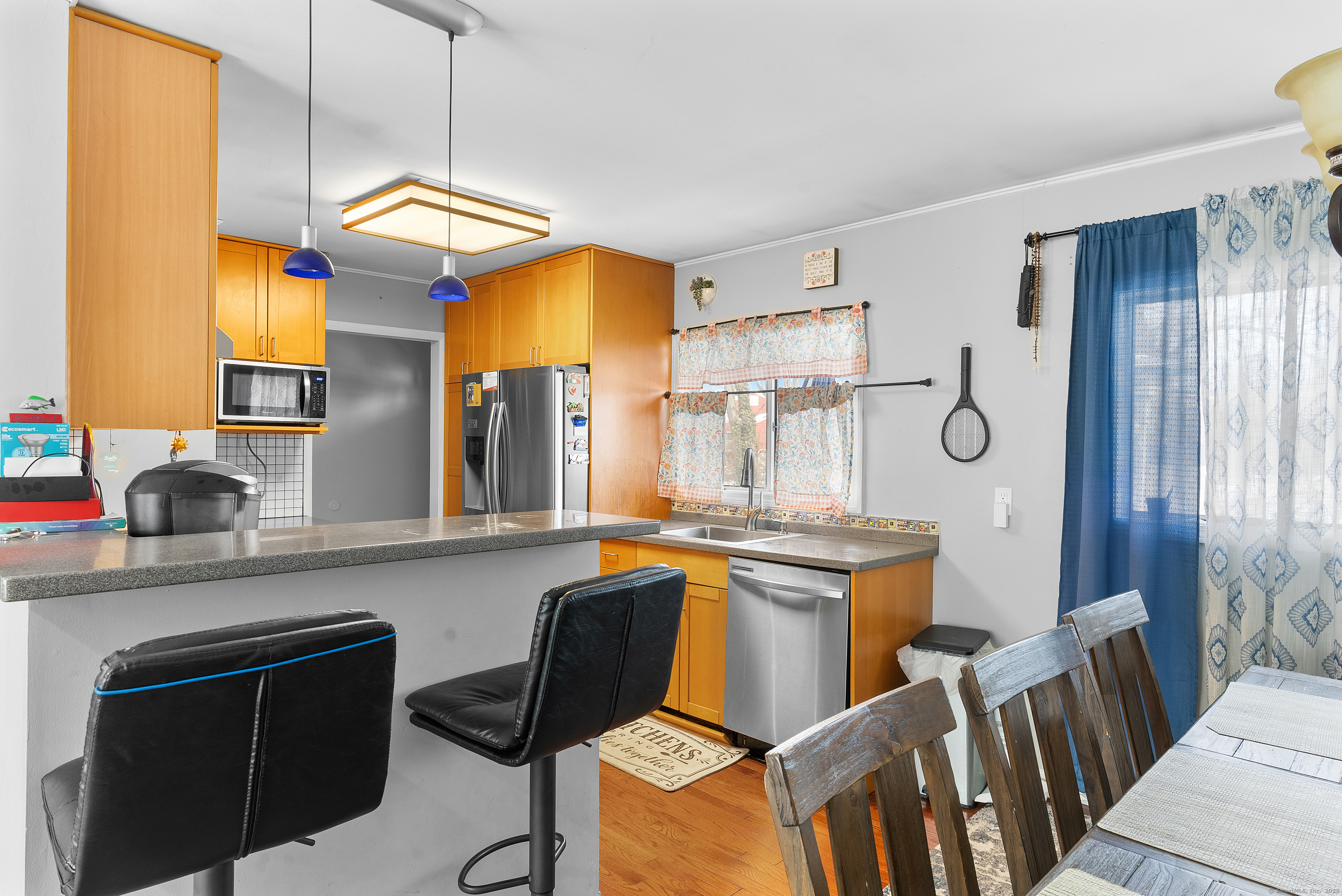 8 Stonecrop Road North Norwalk, CT 06851 - Photo 13 of 15 a kitchen with stainless steel appliances granite countertop a sink a stove and a refrigerator