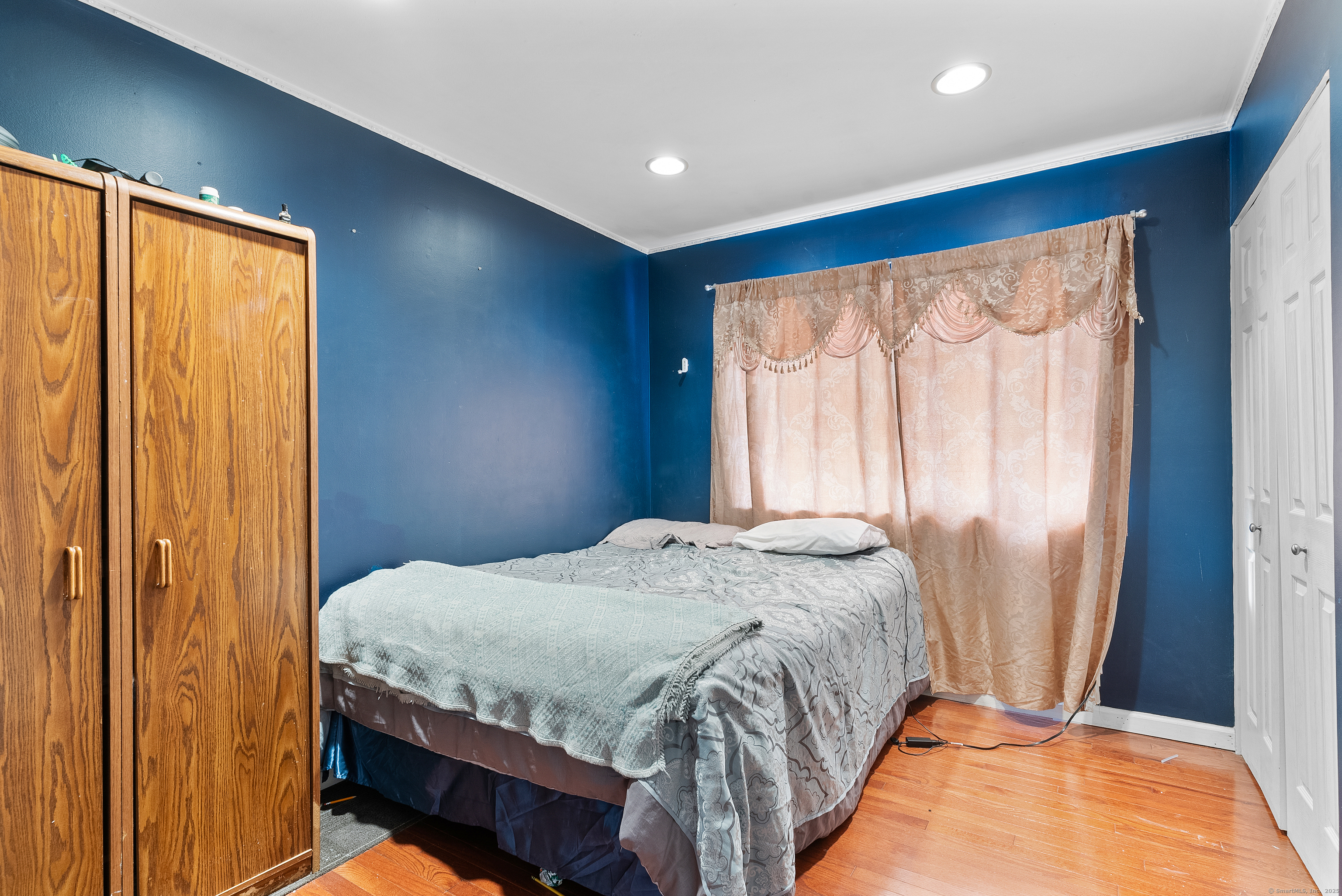 8 Stonecrop Road North Norwalk, CT 06851 - Photo 6 of 15 a bedroom with a bed and a window