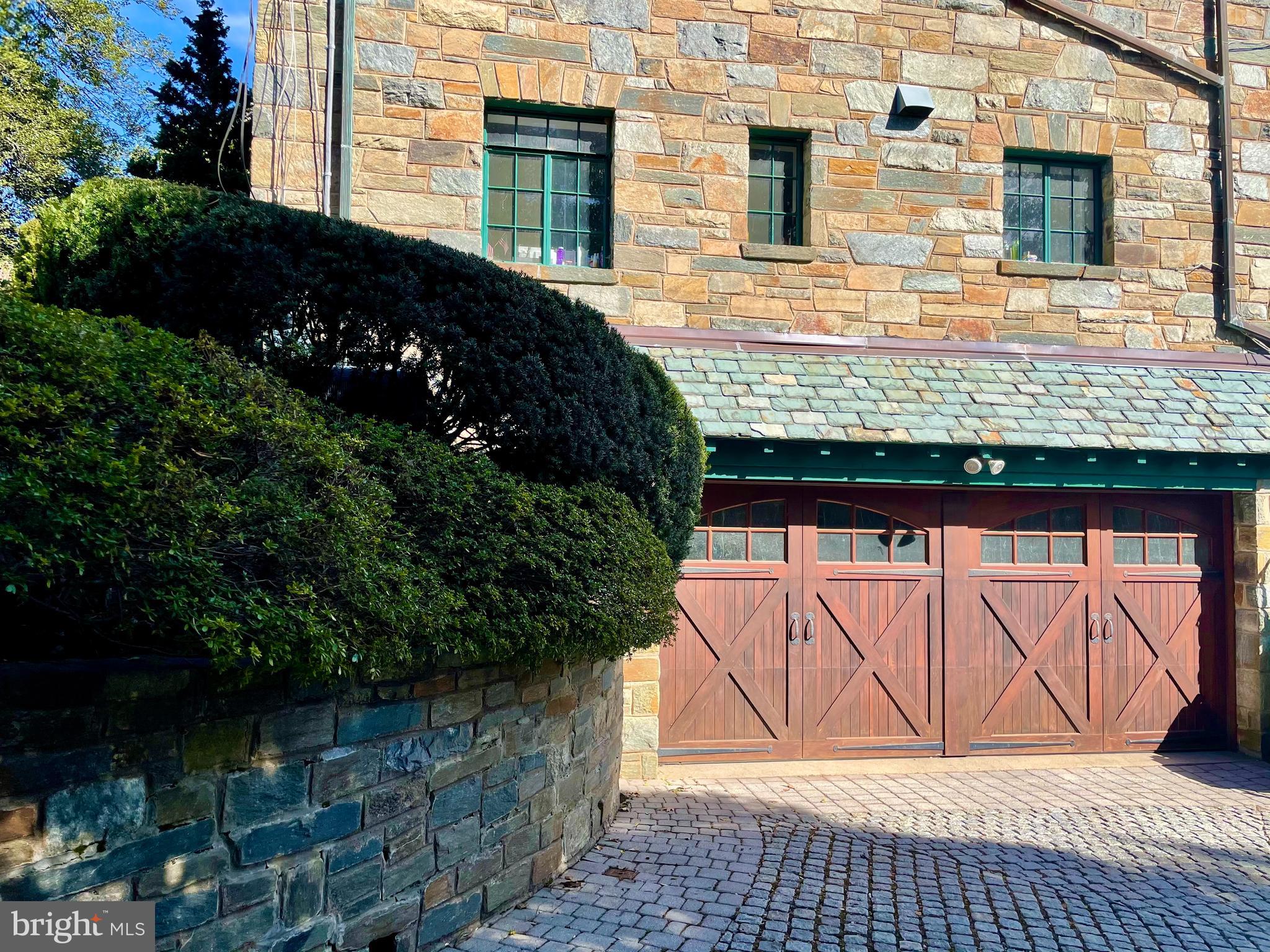 3117 Chain Bridge Road Northwest Washington, DC 20016 - Photo 23 of 26 Custom doors to heated garage, stone driveway