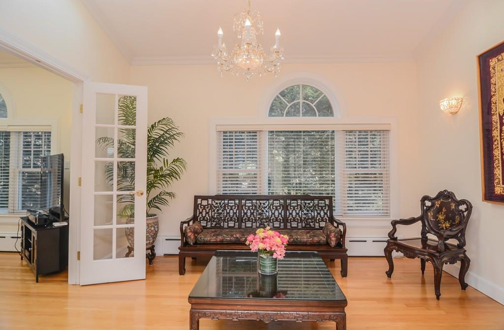 7 Benjamin Road Lexington, MA 02421 - Photo 11 of 42 a living room with furniture and a large window