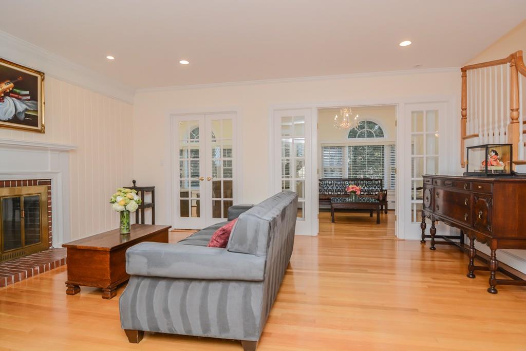 7 Benjamin Road Lexington, MA 02421 - Photo 14 of 42 a living room with furniture and a fireplace