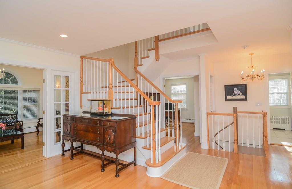 7 Benjamin Road Lexington, MA 02421 - Photo 16 of 42 a living room with furniture and a table