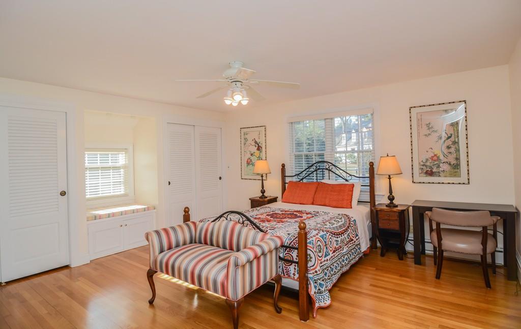 7 Benjamin Road Lexington, MA 02421 - Photo 20 of 42 a bedroom with a bed and wooden floor