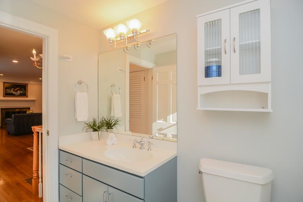 7 Benjamin Road Lexington, MA 02421 - Photo 21 of 42 a bathroom with a sink vanity granite and toilet