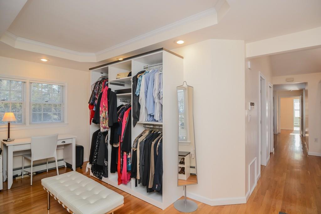 7 Benjamin Road Lexington, MA 02421 - Photo 33 of 42 a view of walk in closet with clothes and shoes