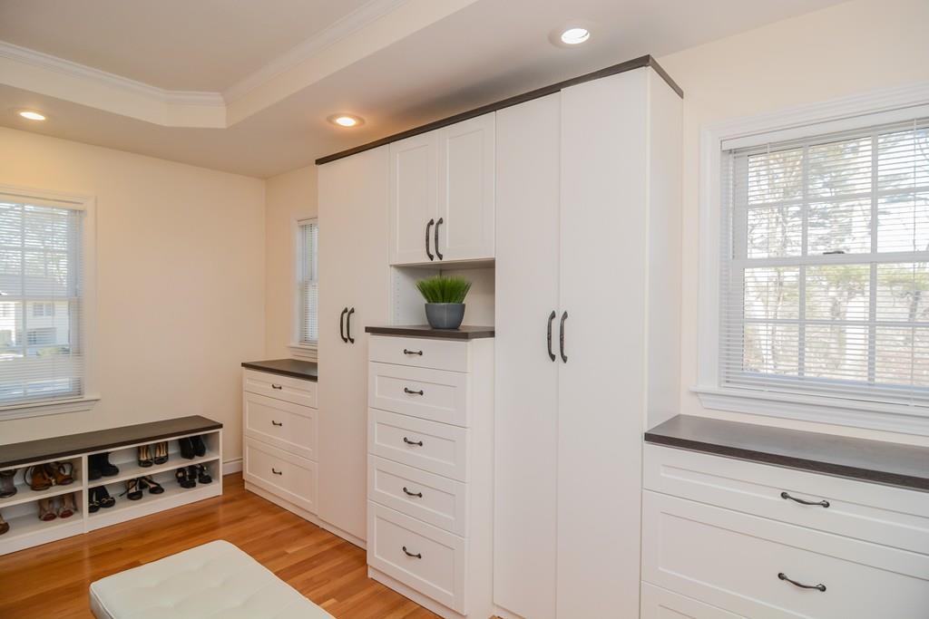 7 Benjamin Road Lexington, MA 02421 - Photo 34 of 42 a bedroom with a bed and a dresser