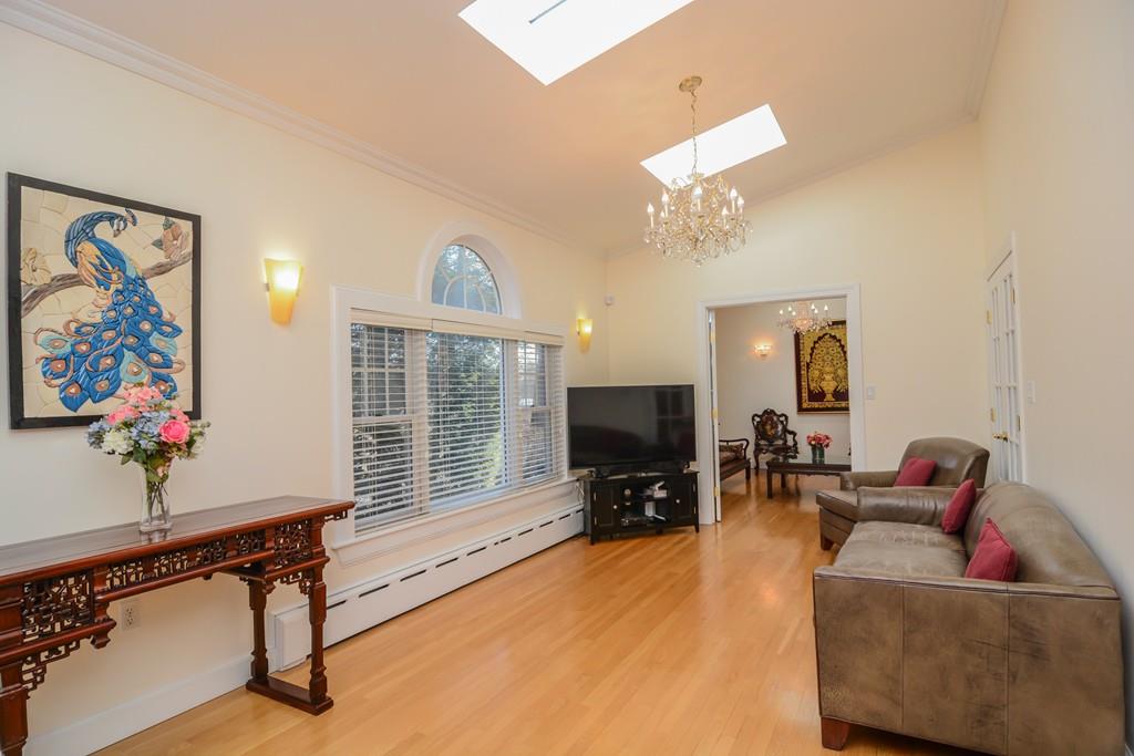 7 Benjamin Road Lexington, MA 02421 - Photo 9 of 42 a living room with furniture and a flat screen tv