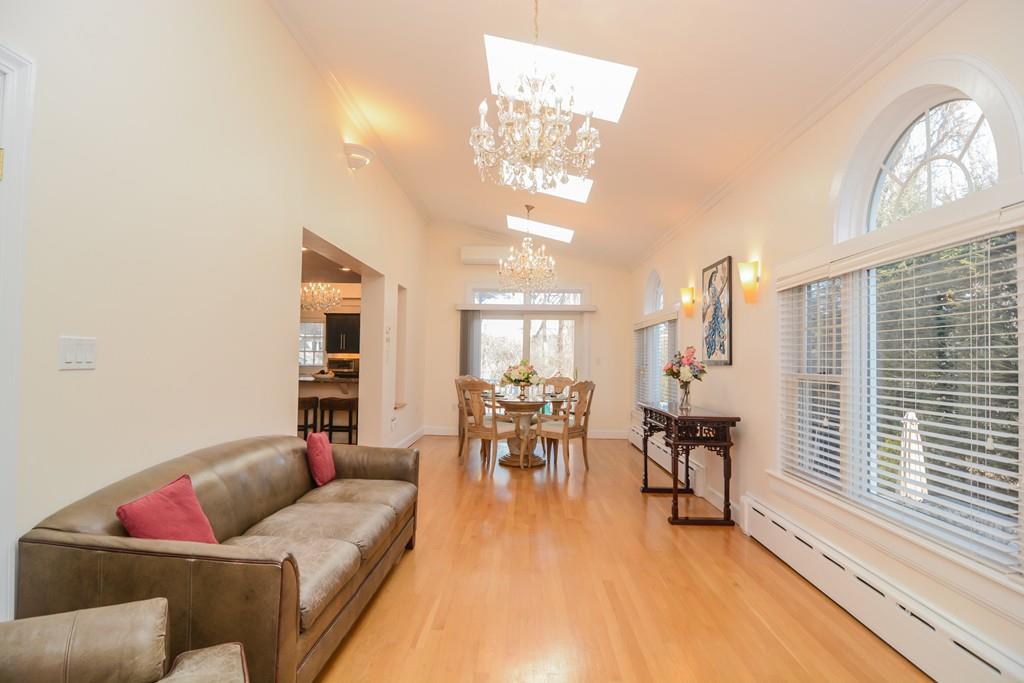 7 Benjamin Road Lexington, MA 02421 - Photo 10 of 42 a living room with furniture and a large window