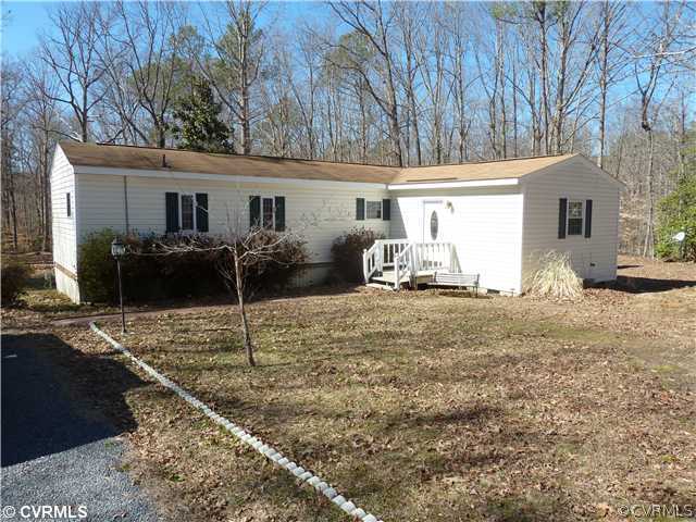 9212 Colemans Lake Road Ford, VA 23850 - Photo 1 of 10 a house view with a backyard space