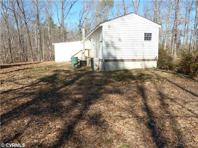 9212 Colemans Lake Road Ford, VA 23850 - Photo 3 of 10 a view of house with backyard