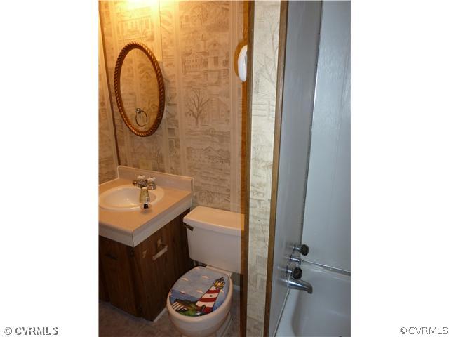 9212 Colemans Lake Road Ford, VA 23850 - Photo 10 of 10 a bathroom with a sink and a mirror
