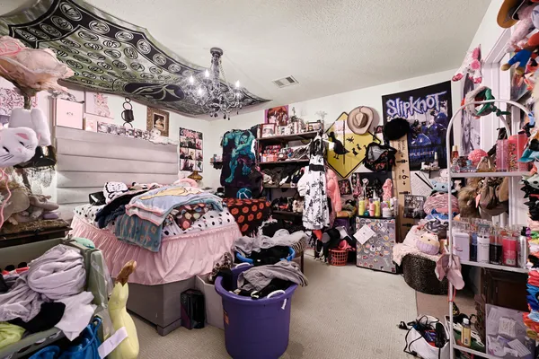 a store room with lots of different colored cloths