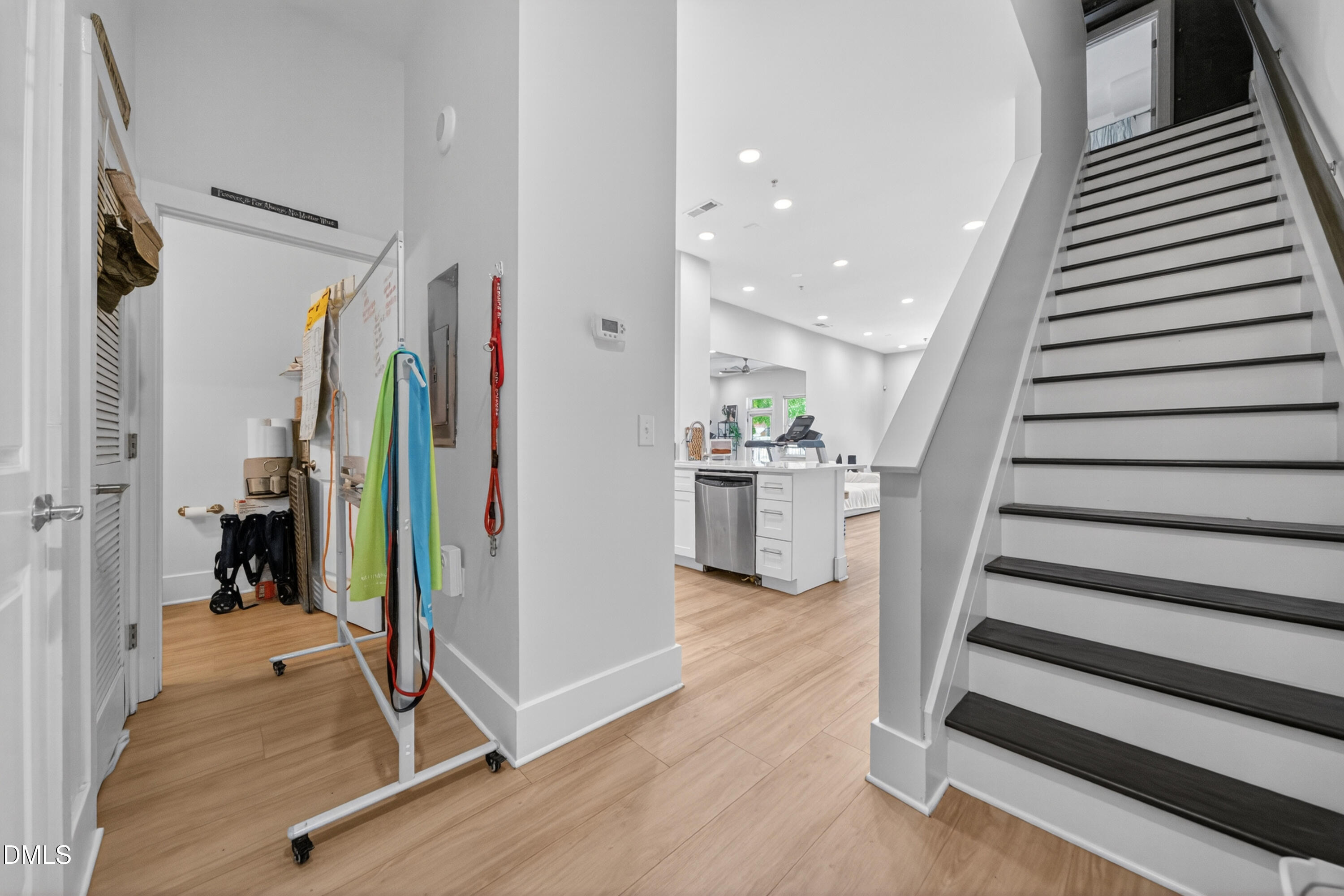 444 South Blount Street, Unit 111 Raleigh, NC 27601 - Photo 26 of 40 a view of a hallway view with staircase and kitchen view