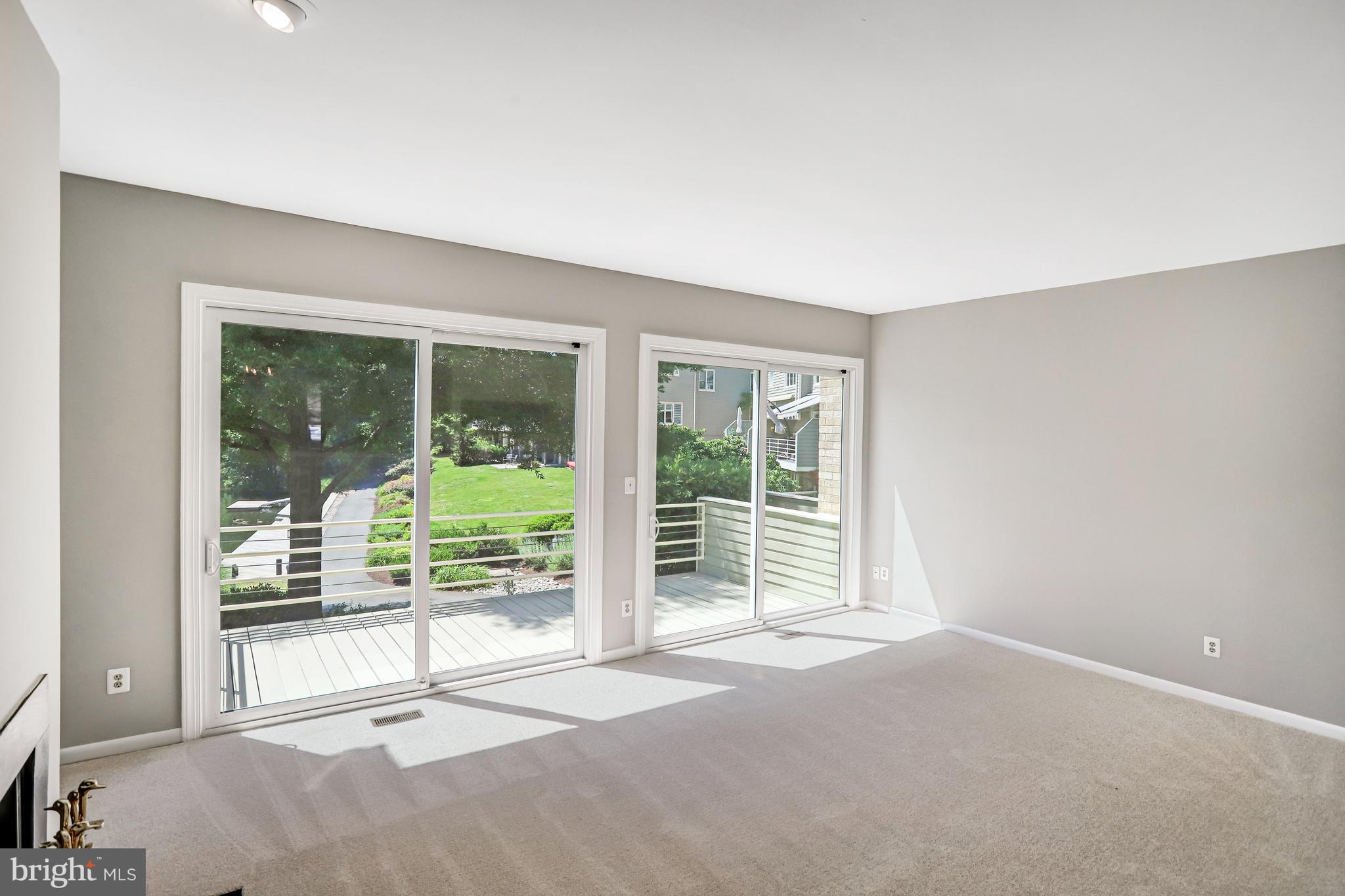 1953 Lakeport Way Reston, VA 20191 - Photo 26 of 60 a view of an empty room with wooden floor and a window