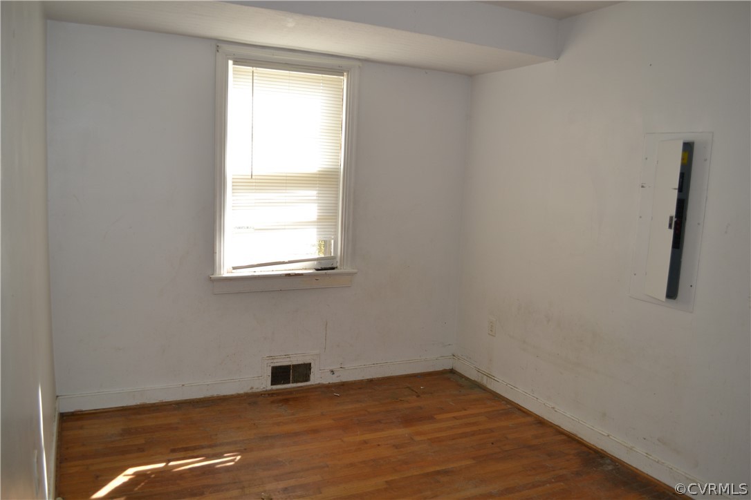 806 Northampton Road Petersburg, VA 23805 - Photo 8 of 11 a view of an empty room with wooden floor and a window