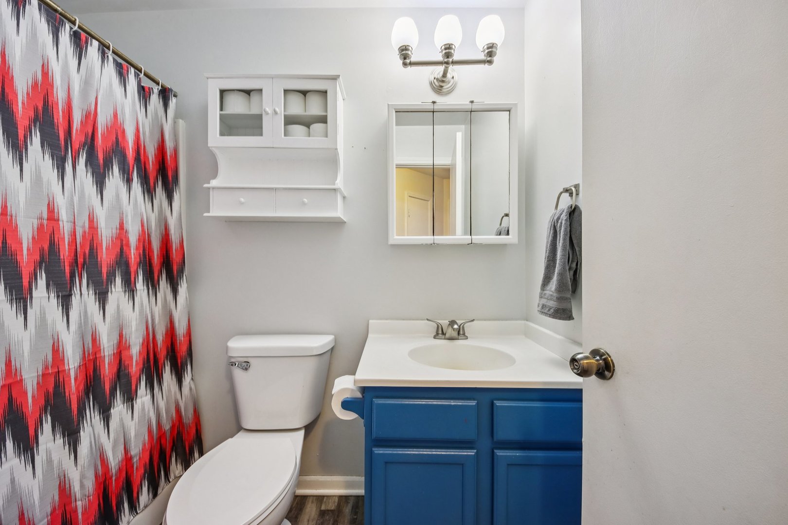 410 Riverside Drive Lakemoor, IL 60051 - Photo 12 of 21 a bathroom with a toilet sink and shower curtain