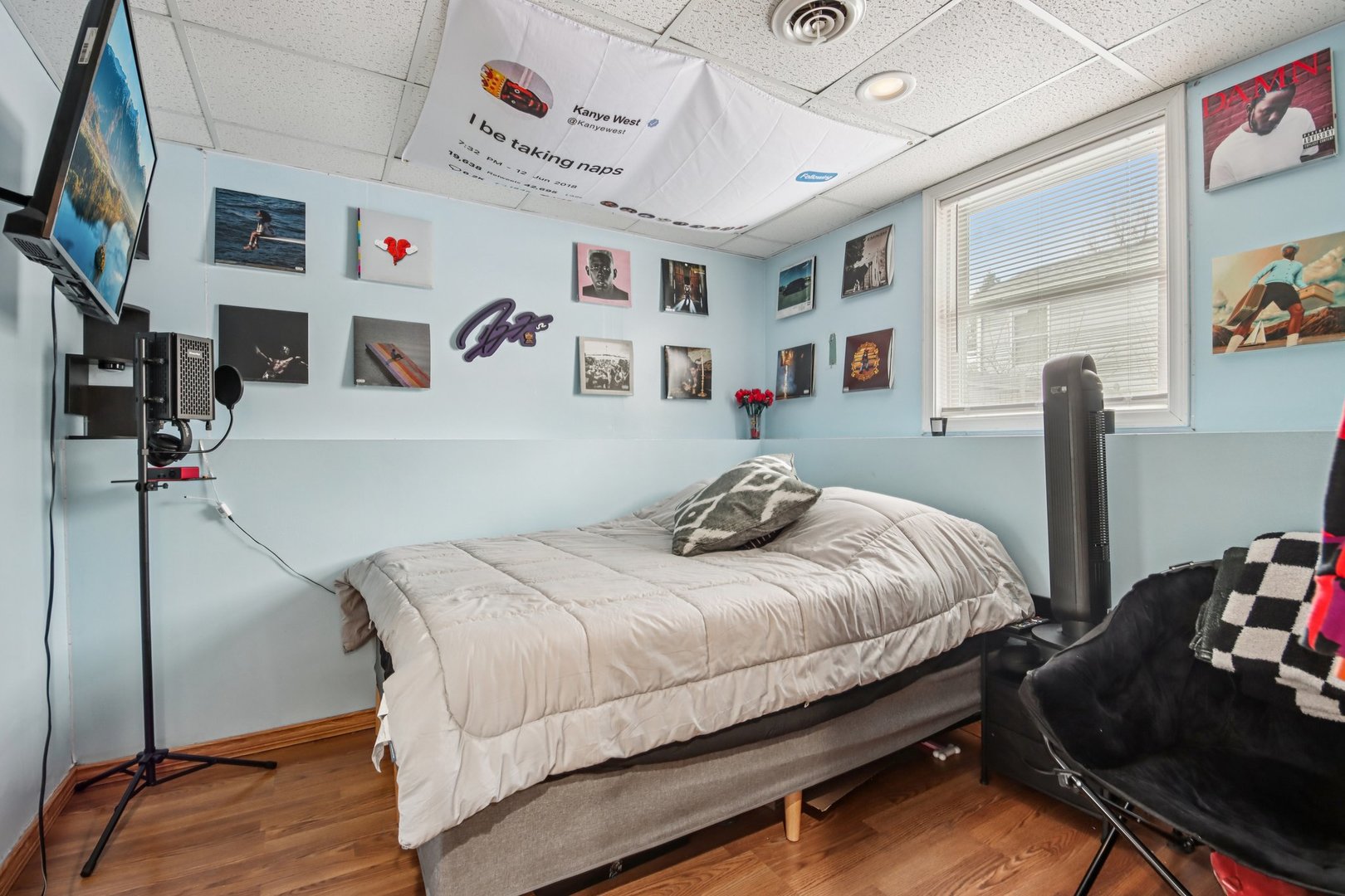 410 Riverside Drive Lakemoor, IL 60051 - Photo 14 of 21 a bedroom with a bed and a bookshelf with wooden floor