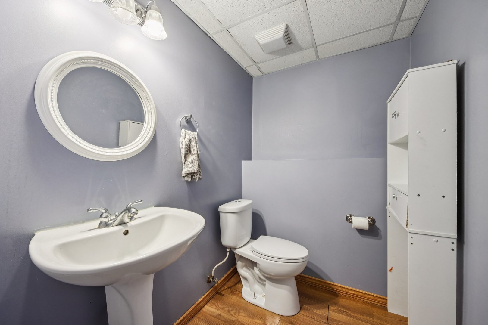 410 Riverside Drive Lakemoor, IL 60051 - Photo 15 of 21 a bathroom with a toilet sink and mirror