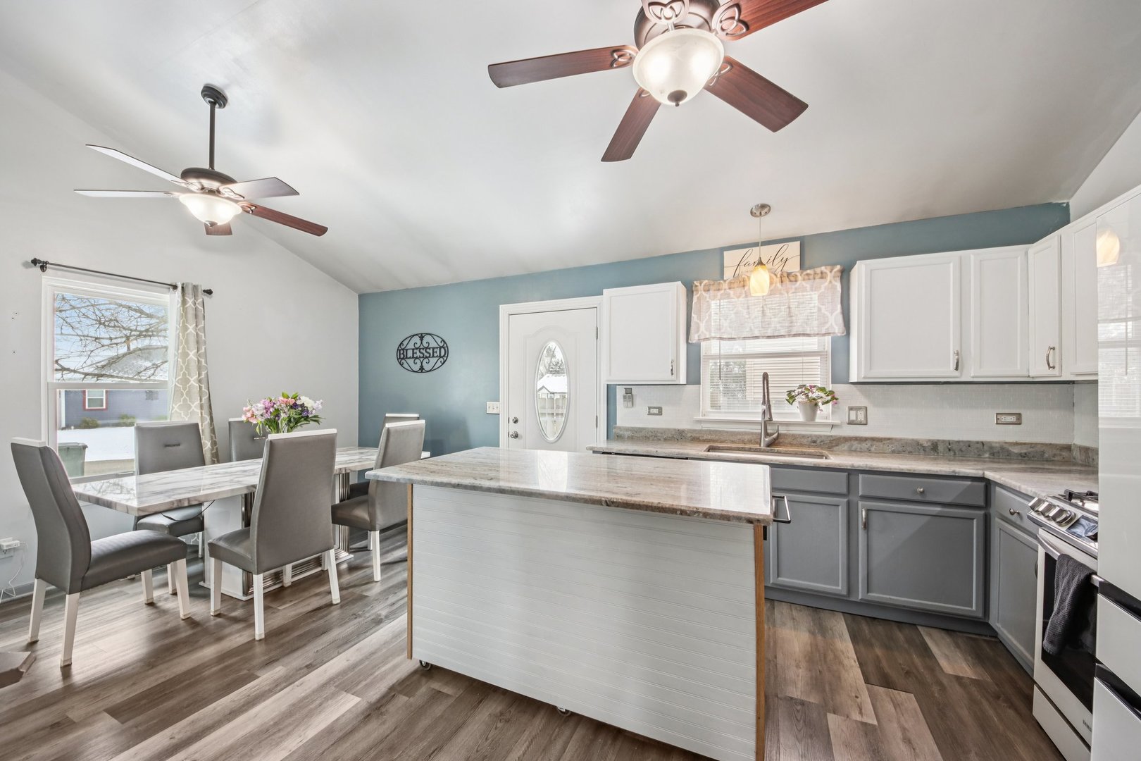 410 Riverside Drive Lakemoor, IL 60051 - Photo 5 of 21 a kitchen with a cabinets dining table and chairs