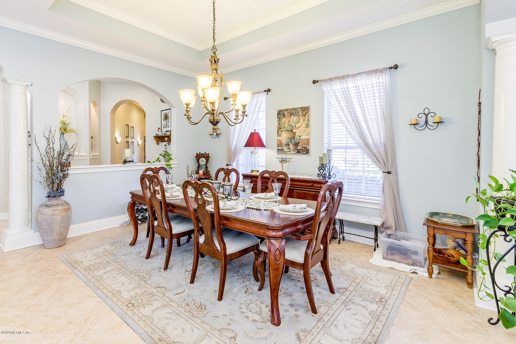 8313 Sheila Drive St. Augustine, FL 32092 - Photo 11 of 54 a view of a dining room with furniture and a chandelier