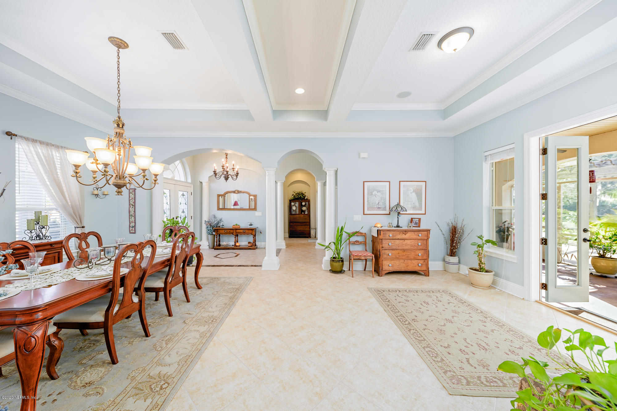 8313 Sheila Drive St. Augustine, FL 32092 - Photo 13 of 54 a living room with furniture and a chandelier