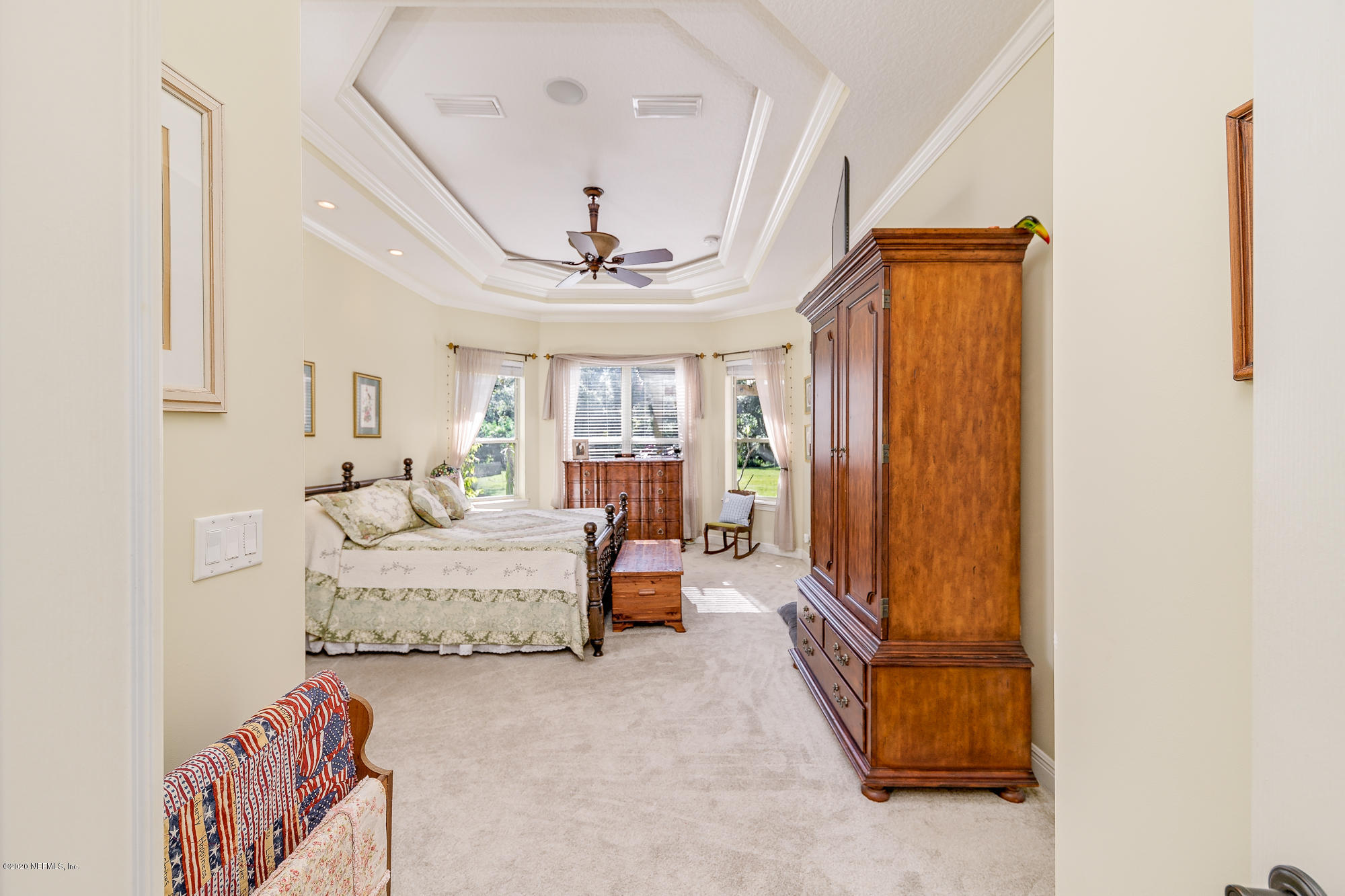8313 Sheila Drive St. Augustine, FL 32092 - Photo 23 of 54 a living room with furniture and a flat screen tv