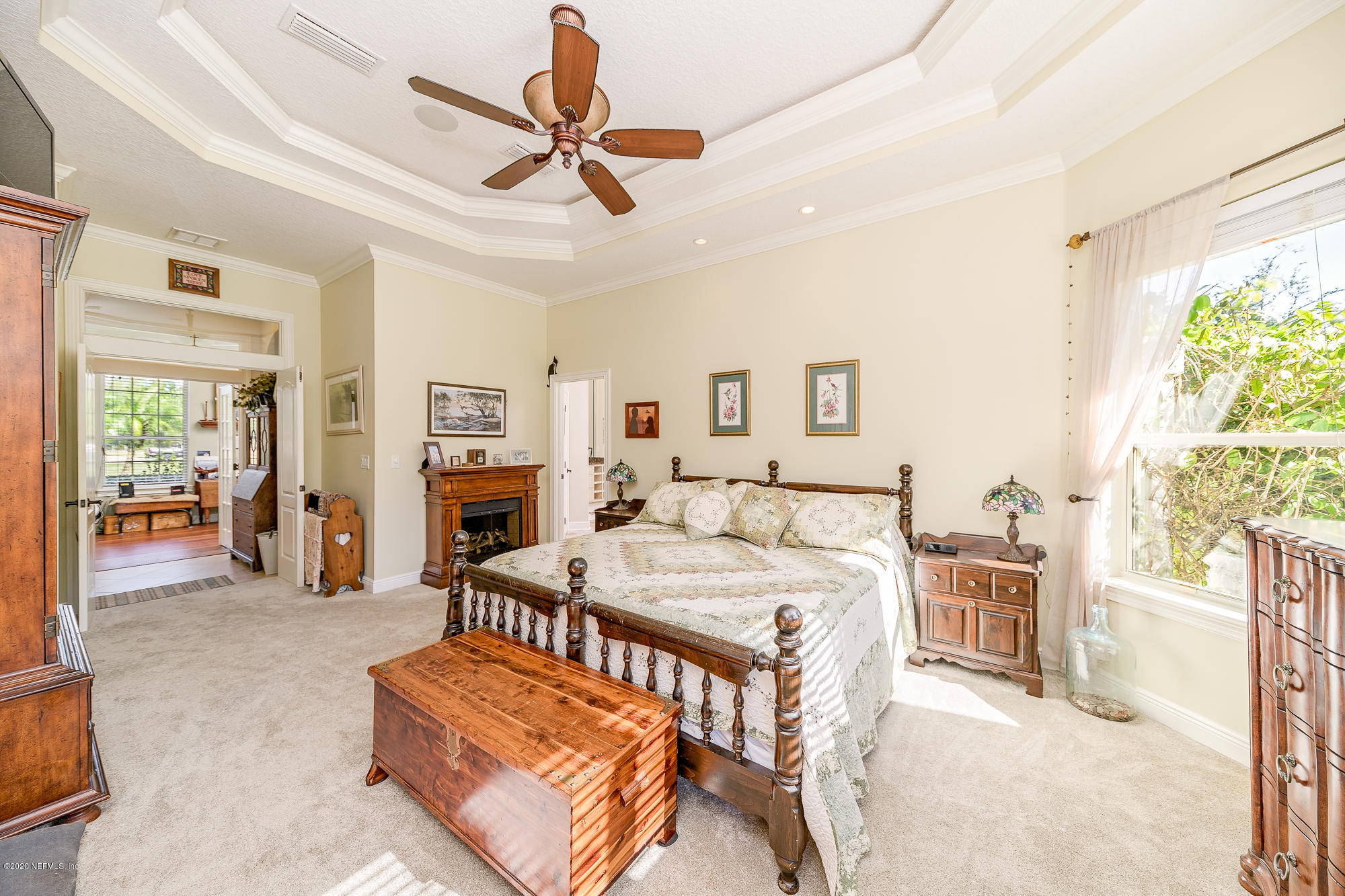 8313 Sheila Drive St. Augustine, FL 32092 - Photo 25 of 54 a living room with furniture a fireplace and a flat screen tv