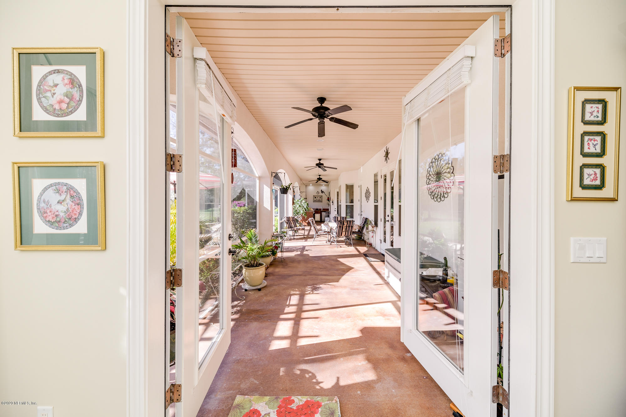 8313 Sheila Drive St. Augustine, FL 32092 - Photo 26 of 54 a view of a hallway with wooden floor and staircase