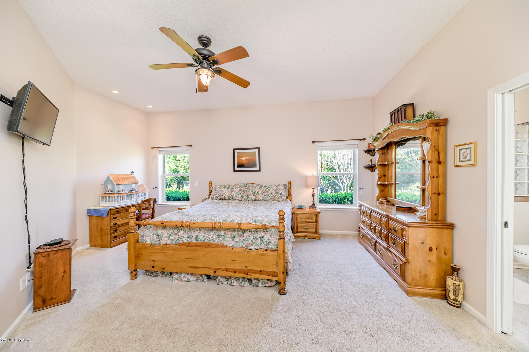 8313 Sheila Drive St. Augustine, FL 32092 - Photo 35 of 54 a bedroom with furniture and window