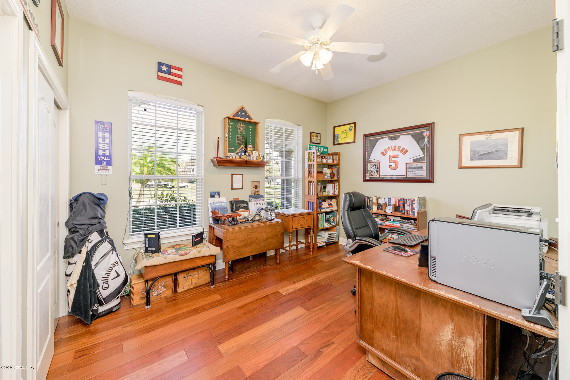 8313 Sheila Drive St. Augustine, FL 32092 - Photo 37 of 54 a living room with furniture a flat screen tv and a window
