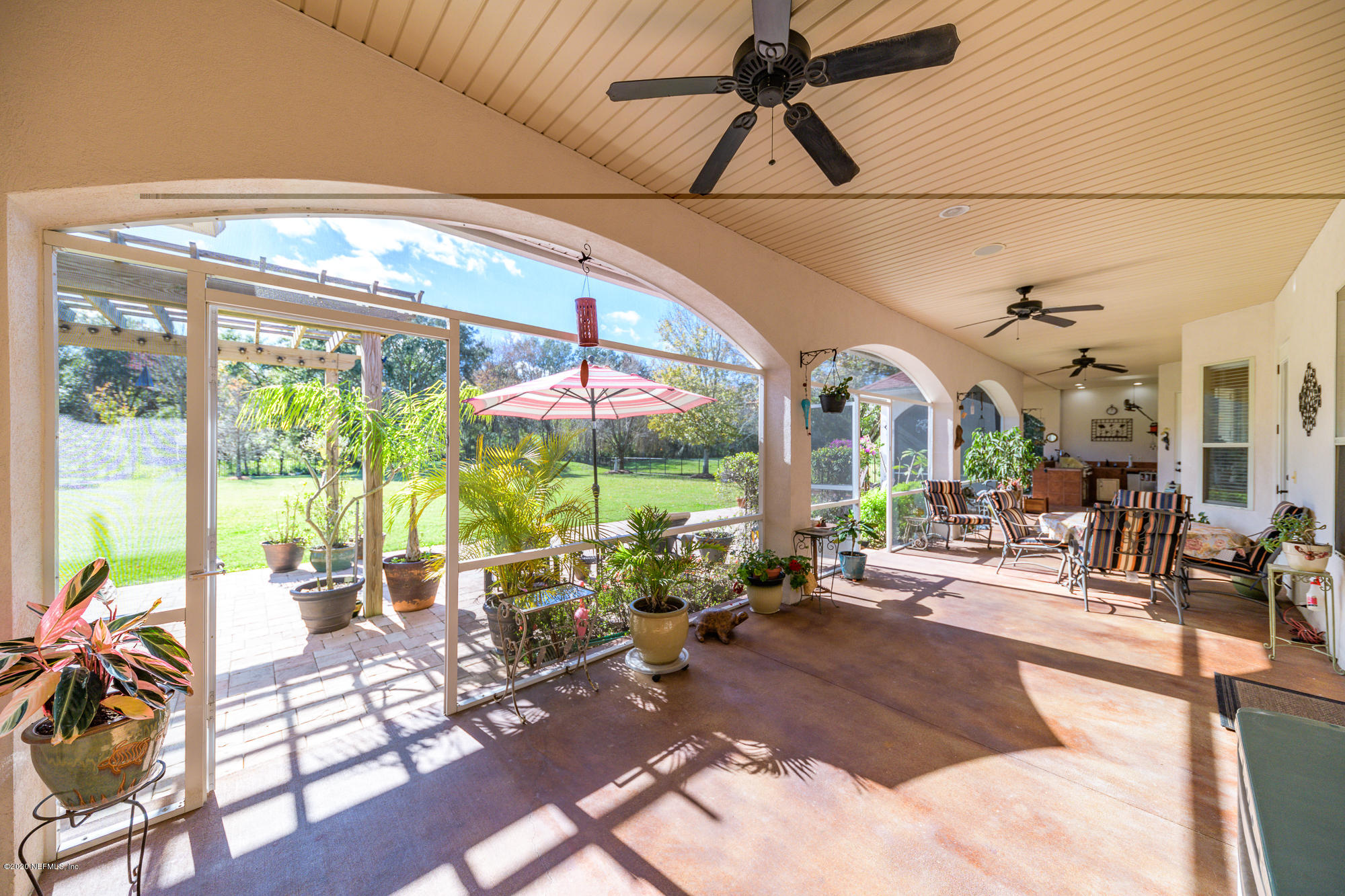 8313 Sheila Drive St. Augustine, FL 32092 - Photo 39 of 54 a living room with patio furniture and a large window