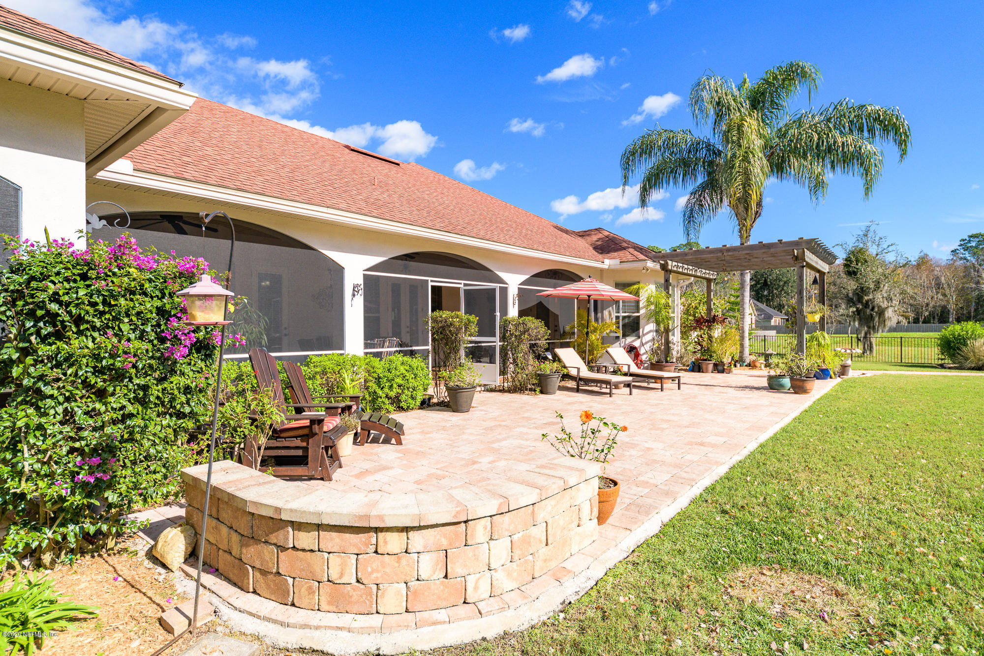 8313 Sheila Drive St. Augustine, FL 32092 - Photo 44 of 54 a view of a house with backyard porch and patio