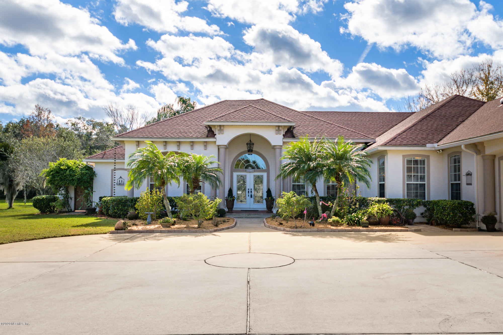 8313 Sheila Drive St. Augustine, FL 32092 - Photo 5 of 54 a front view of a house with a yard