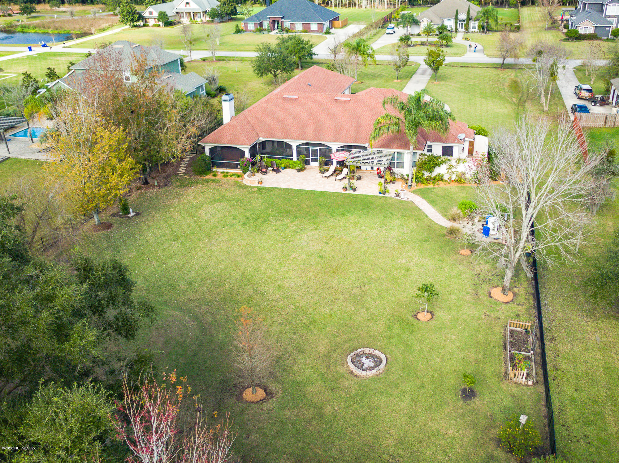 8313 Sheila Drive St. Augustine, FL 32092 - Photo 52 of 54 a view of a house with a big yard