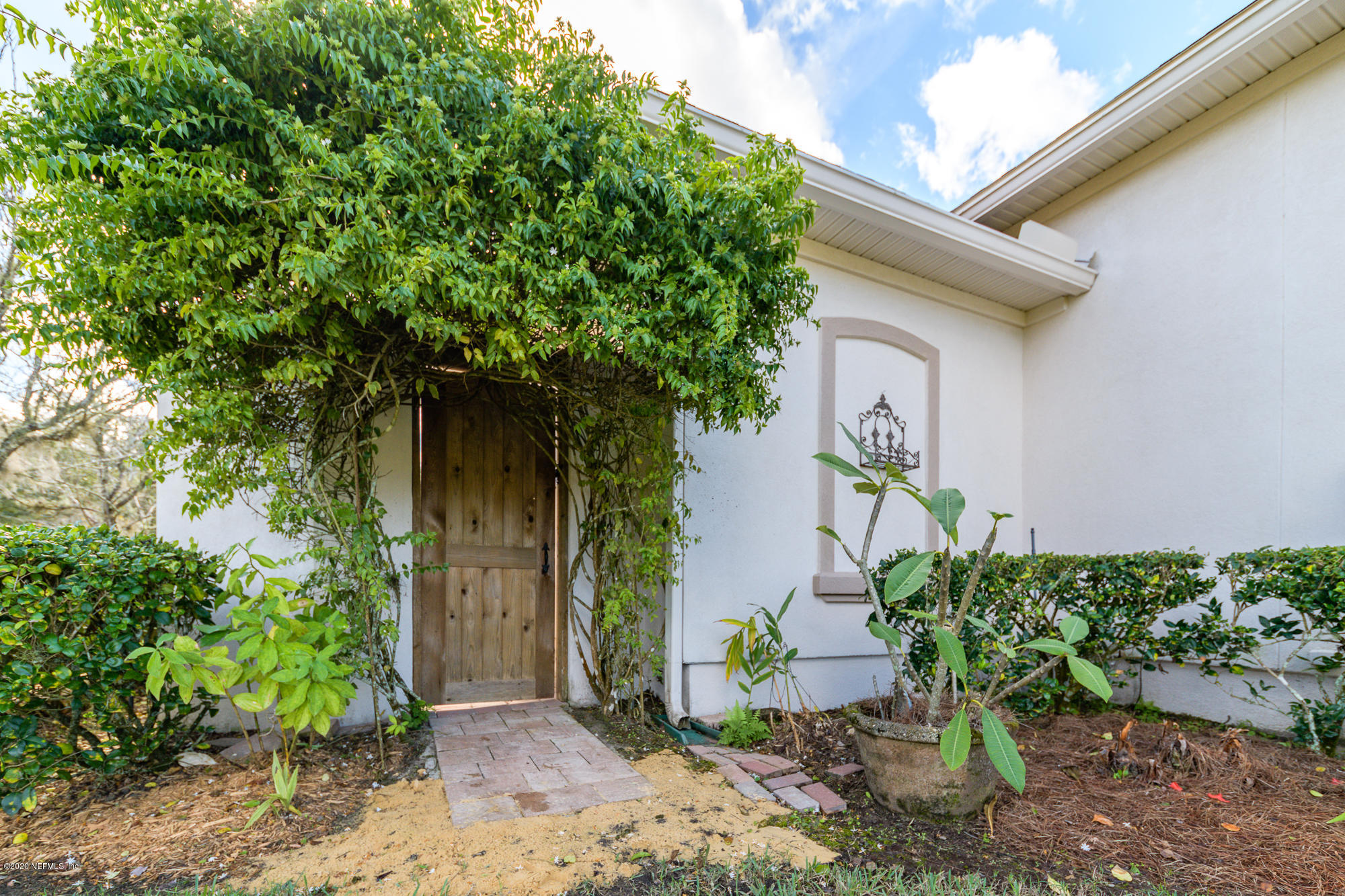 8313 Sheila Drive St. Augustine, FL 32092 - Photo 6 of 54 a front view of a house with garden