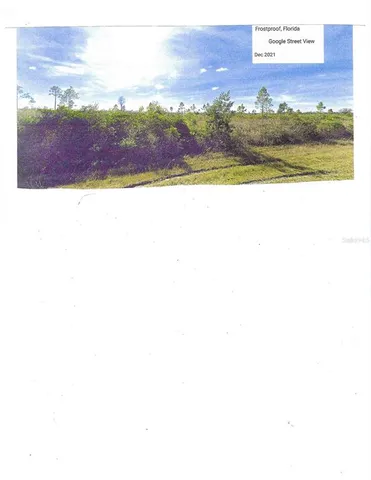 a view of a yard with an ocean