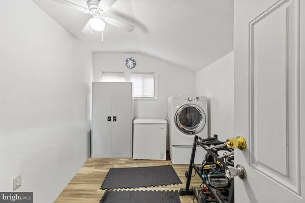 a view of a hallway with washer and dryer