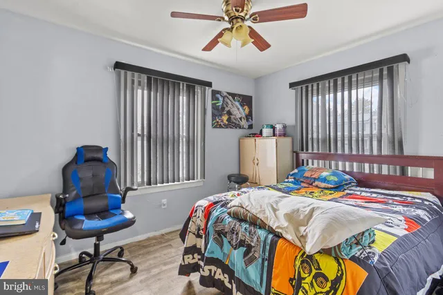 a bedroom that has a bed and a chair in it