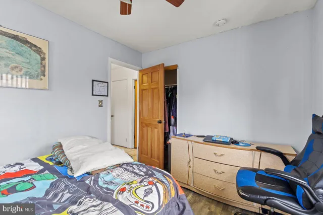 a bedroom with a bed and furniture