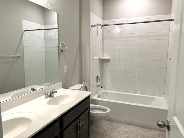 a bathroom with a double vanity sink and mirror