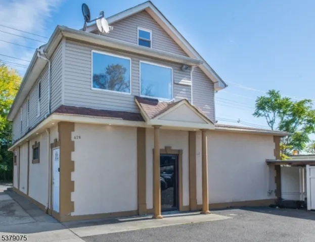 a front view of a house with garage