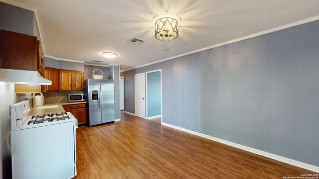 a view of kitchen and wooden floor