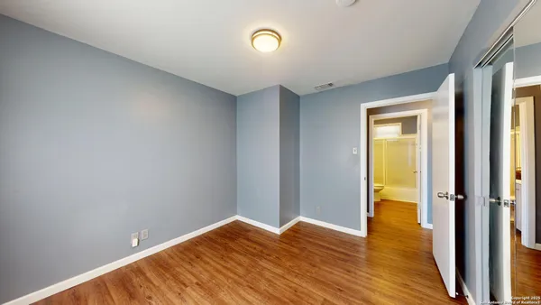 a view of room with wooden floor