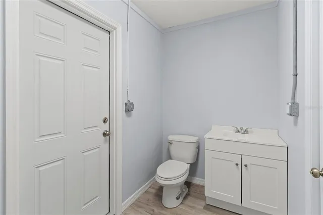 a bathroom with a sink toilet and vanity