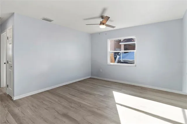 a view of an empty room with a window